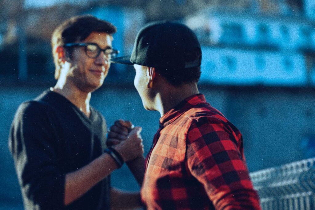 two young men handshake