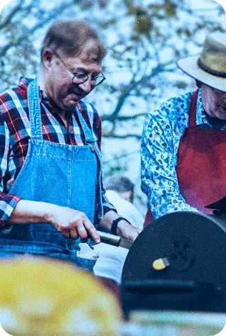 two mature gentlemen grilling