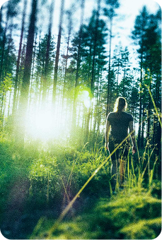 woman hiking into the sunlight
